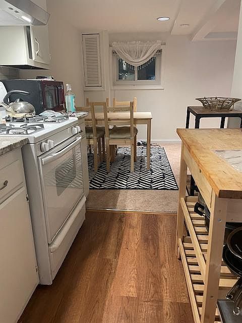 Galley kitchen view into dining area.