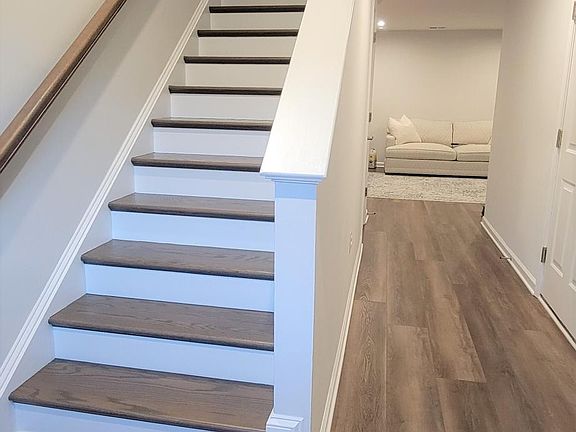 First floor features garage access and a large bonus room with bathroom.