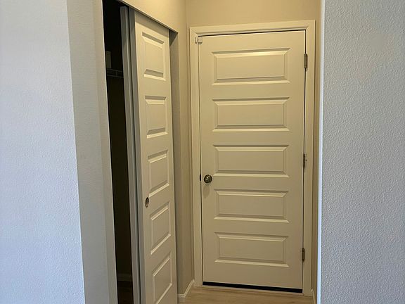 Coat closet/entrance to garage
