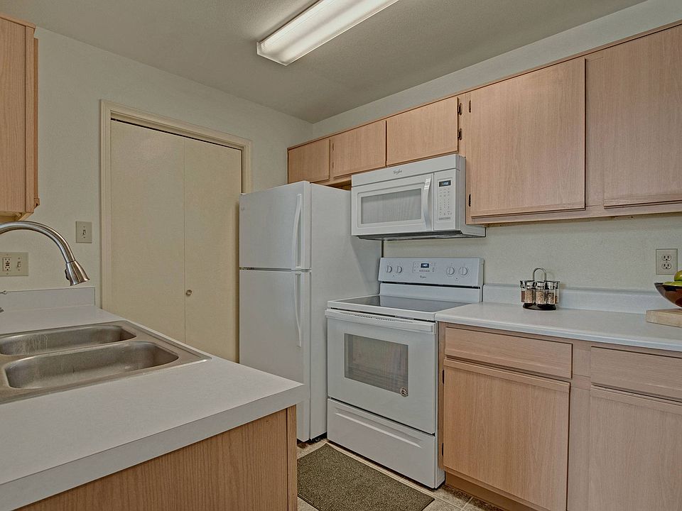 St. James Place Kitchen View with Fridge, Oven, and Microwave