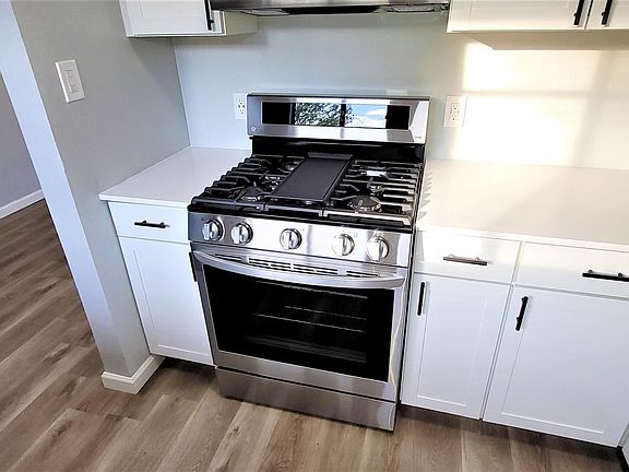 Gas- chef-inspired stove with griddle.