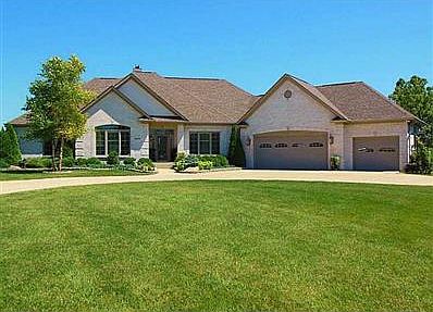 Exterior Front. You ll fall in love with all this Custom home has to offer. Built in 2007 w/ an all brick exterior, this is located on a quiet cul-de-sac street, featuring a huge 3 car + garage and the best of lakefront living.