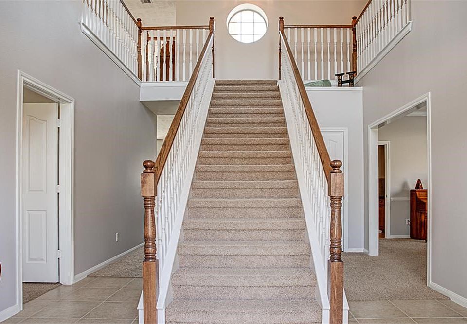 NEW interior paint throughout! Stunning staircase greets your guests.