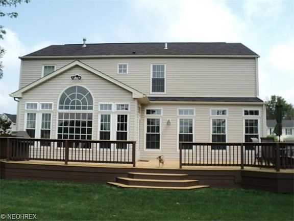 Rear elevation with expansive back deck. Look at all of those windows !
