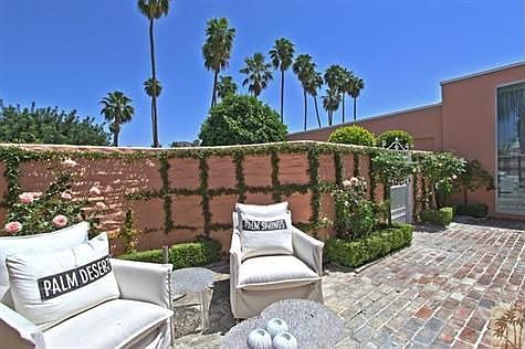 Inviting East facing Courtyard- . Beautifully appointed with roses and boxwood.