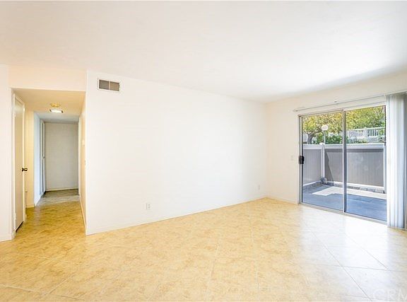 Living room with sliding glass door to patio