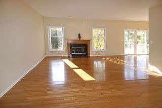Living Room with wood-burning fireplace and southern exposure