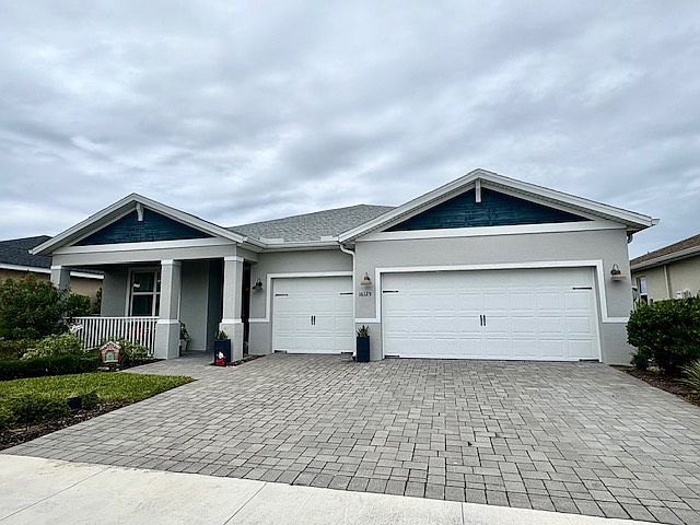 Spacious * 3-car garage with a porch
