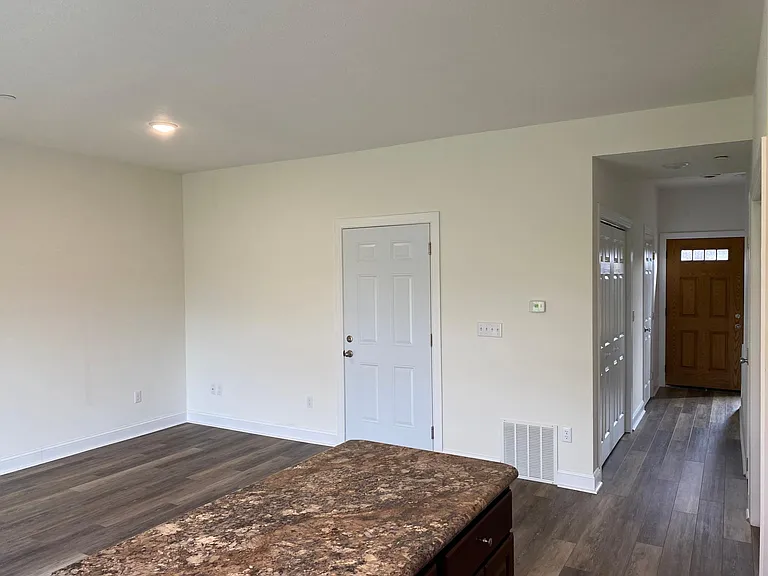 Family Room with Garage door entrance / exit and hallway