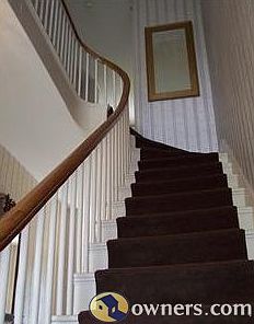 elegant stairwell upon entering the home