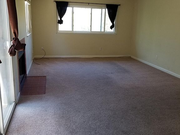 Living room. New carpet scheduled just not in time for picture