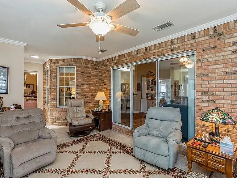 Cozy Bonus Florida Room with gas fireplace and 1/2 bath.