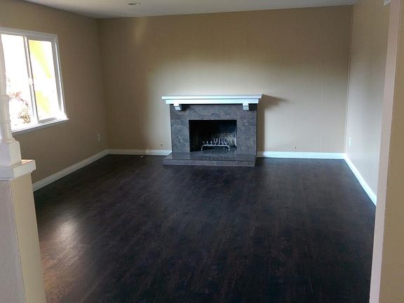 LIVING ROOM WITH LARGE WINDOW AND FIREPLACE