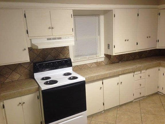 Not shown in this photo is a Microwave left of the Electric Range. On the opposite wall to the right side of the photo is the Refrigerator, Washer and Dryer. The ice maker does not work on the Refrigerator