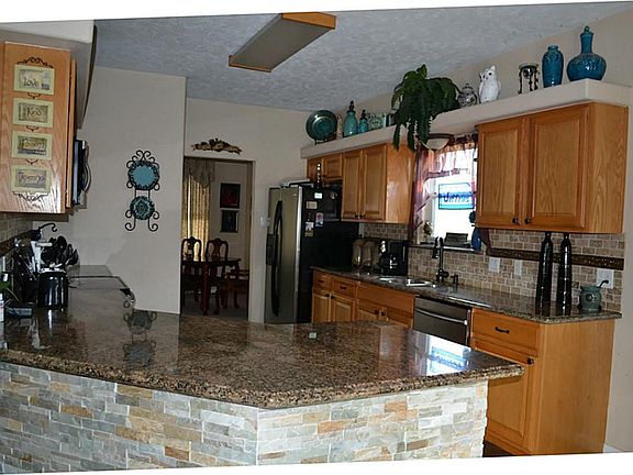 View of kitchen, breakfast room from formal dining room.
