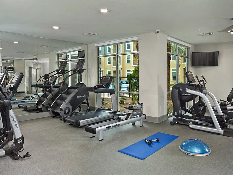 Expansive fitness center with Stairmaster and Water Rower