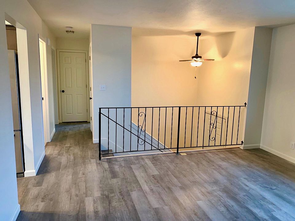 Spacious upstairs living room which boasts natural light. Complete with a fireplace. Home also has a downstairs living room with a fireplace and large window.