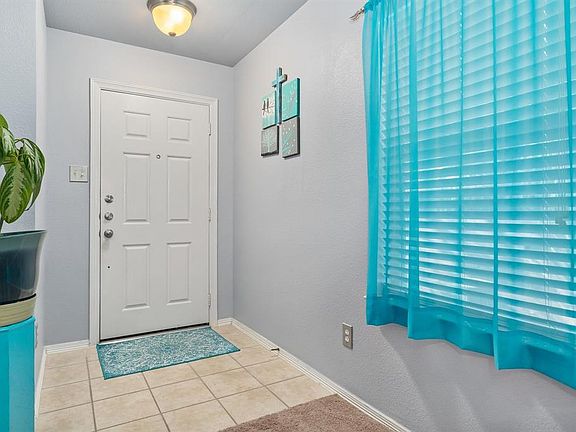 Tiled entry way into your new home.
