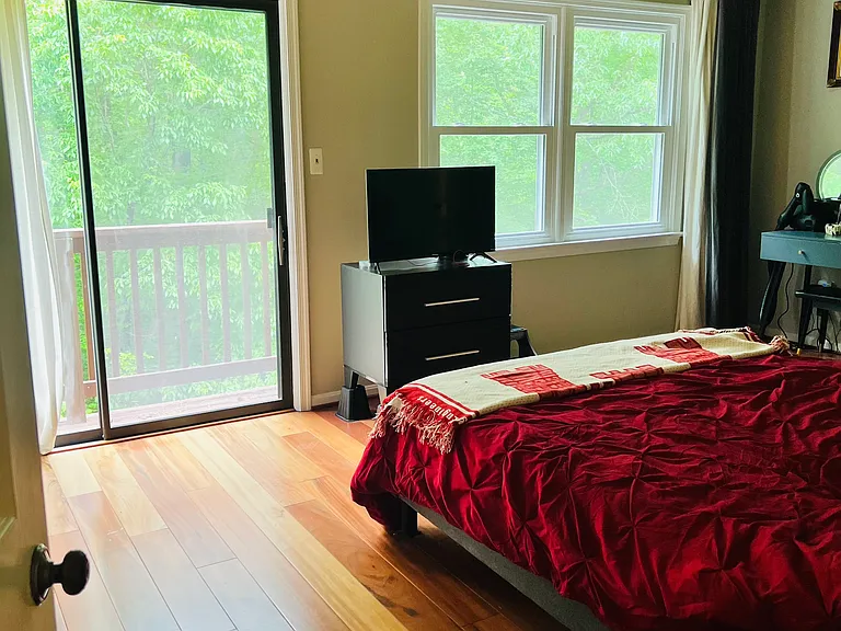 Master bedroom with private deck and large walk-in closet