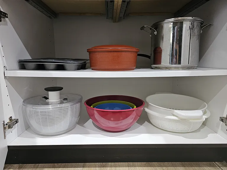 Additional kitchen items include: salad spinner, bowls, strainer, tortilla warmer, and cupcake tins