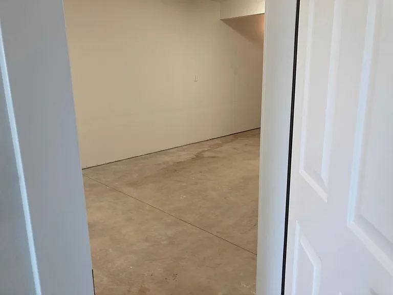 Interior door in hallway opens to garage