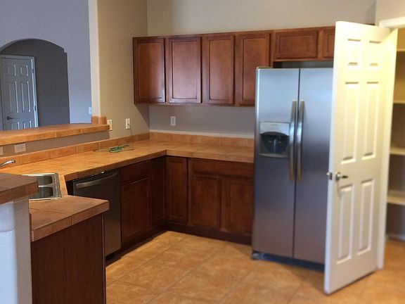 Kitchen open to great room and dining area