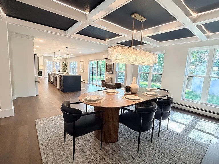 Dining room with tray ceilings with lighting