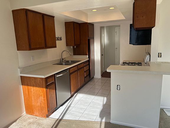 Kitchen viewed from dining room. Entry closet in background.