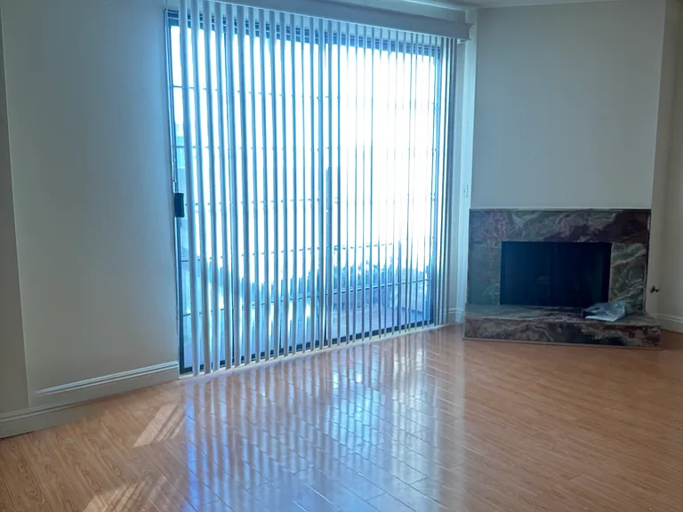 Living room with new flooring and fireplace