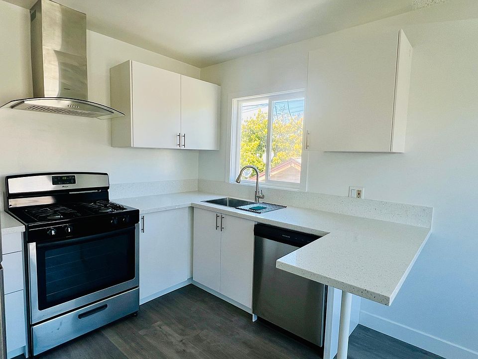 Kitchen with brand new cabinets, granite countertops, stainless steel appliances. Plenty of storage including a full length pantry.