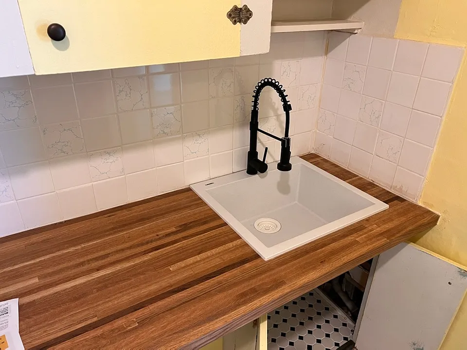 Kitchen. New countertop, sink, and faucet.