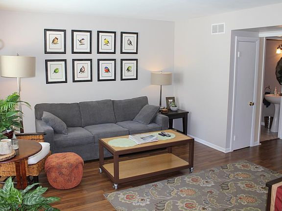 Living room from entry with coat closet and half bath