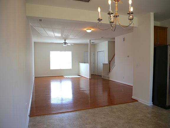 from the dining room corner looking to the front. Big windows looking out from the spacious open front room
