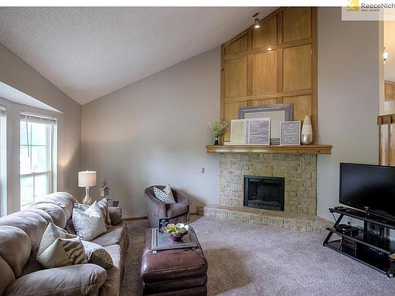 Beautiful stone fireplace and wood mantel