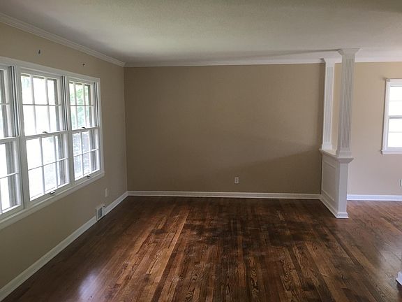 Open living room with newly finished wood floors!