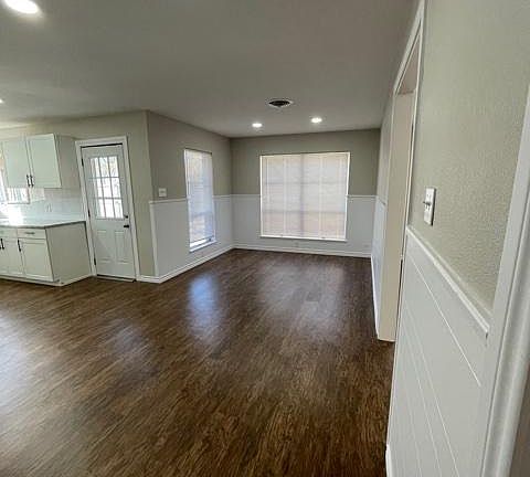 Dining next to kitchen and back door.