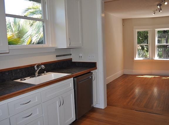 Open flow between kitchen and dining area.