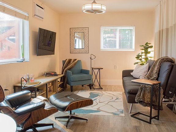 Plantation blinds can be pulled up for optimum view of the deck space or lowered and tilted to provide shade.