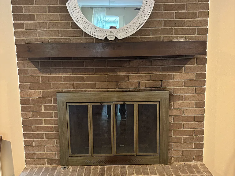 Wood burning fireplace with a gas starter.