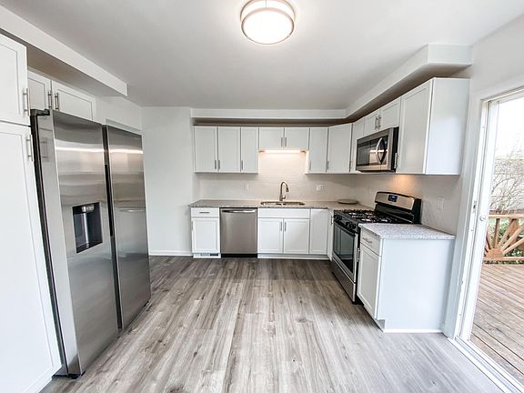 All brand new stainless steel appliances, gas stove, kitchen cabinets, quartz countertops, fixtures, and luxury vinyl plank flooring