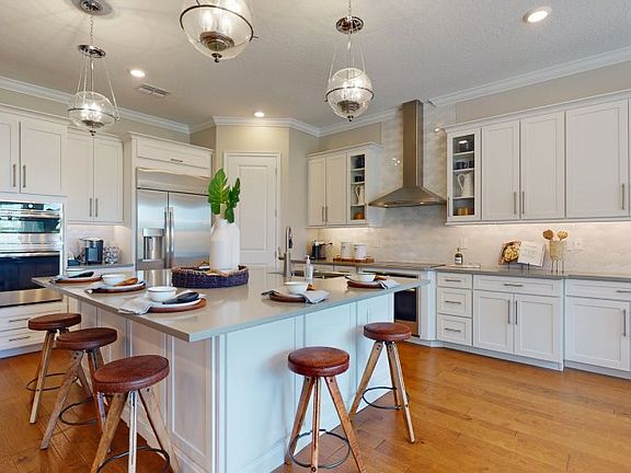 Luxurious quartz countertops keep the space stylish, while a large center island offers additional s