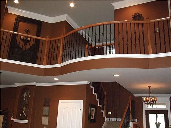 2-Story Living Room with Wrought Iron Cat Walk