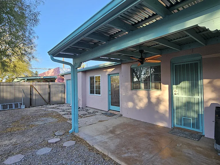 Laundry room is far left teal door with extra storage