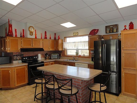 Large Kitchen with loads of cabinets and center island.
