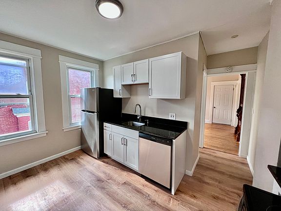 Renovated eat-in kitchen with new stainless appliances