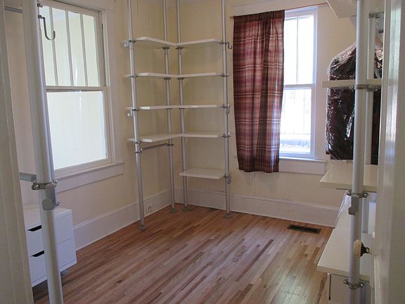 Bedroom 1 outfitted as an office/walk-in closet