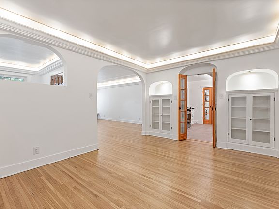 Original hardwood floors and built in china cabinets