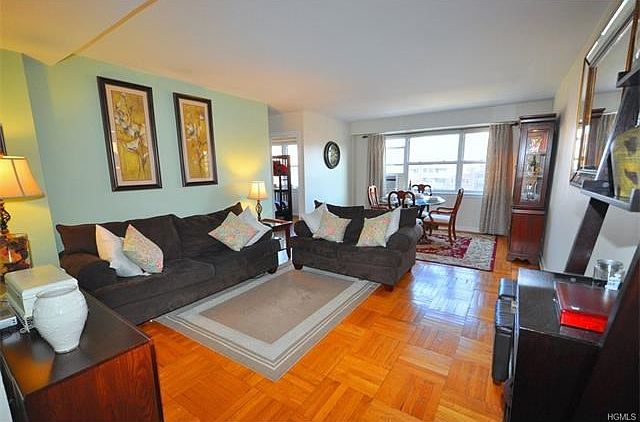 The bright and sunny living room overlooks tree lined Garth Road and has parquet floors.  The room also opens to the large entry foyer.  The living room is 22'-0"x13'-0".