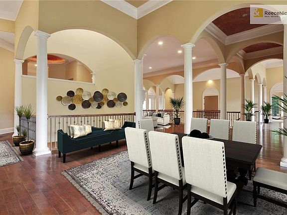 Virtually staged dining area with 18' coffered ceiling.