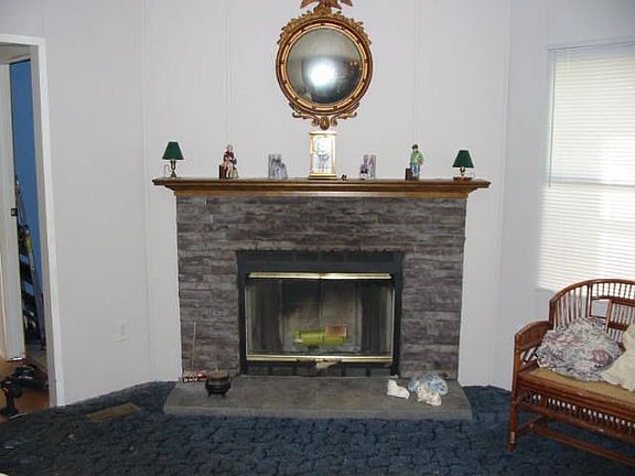 Stone fireplace in Den